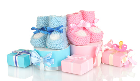 baby boots, pacifier, gifts and blank postcard isolated